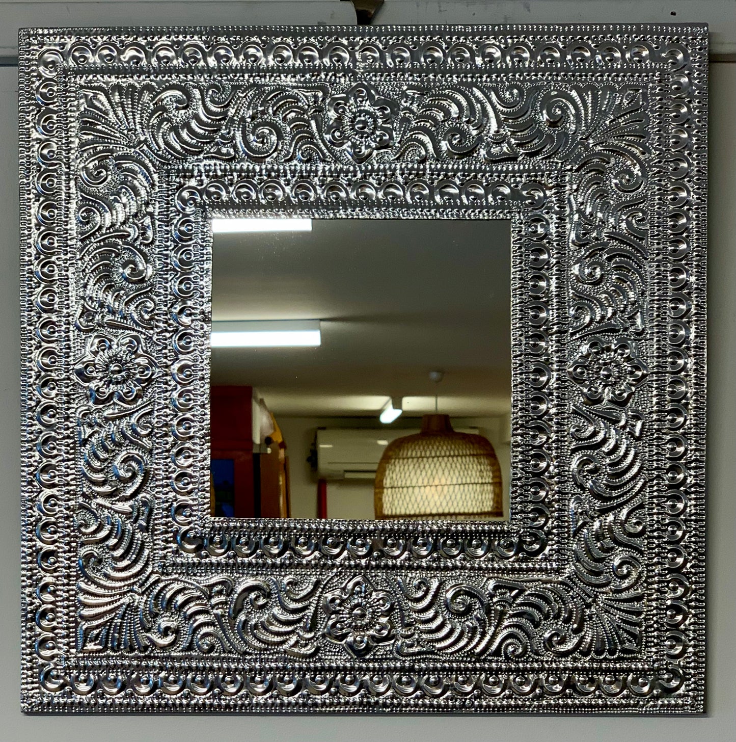Pressed tin mirror